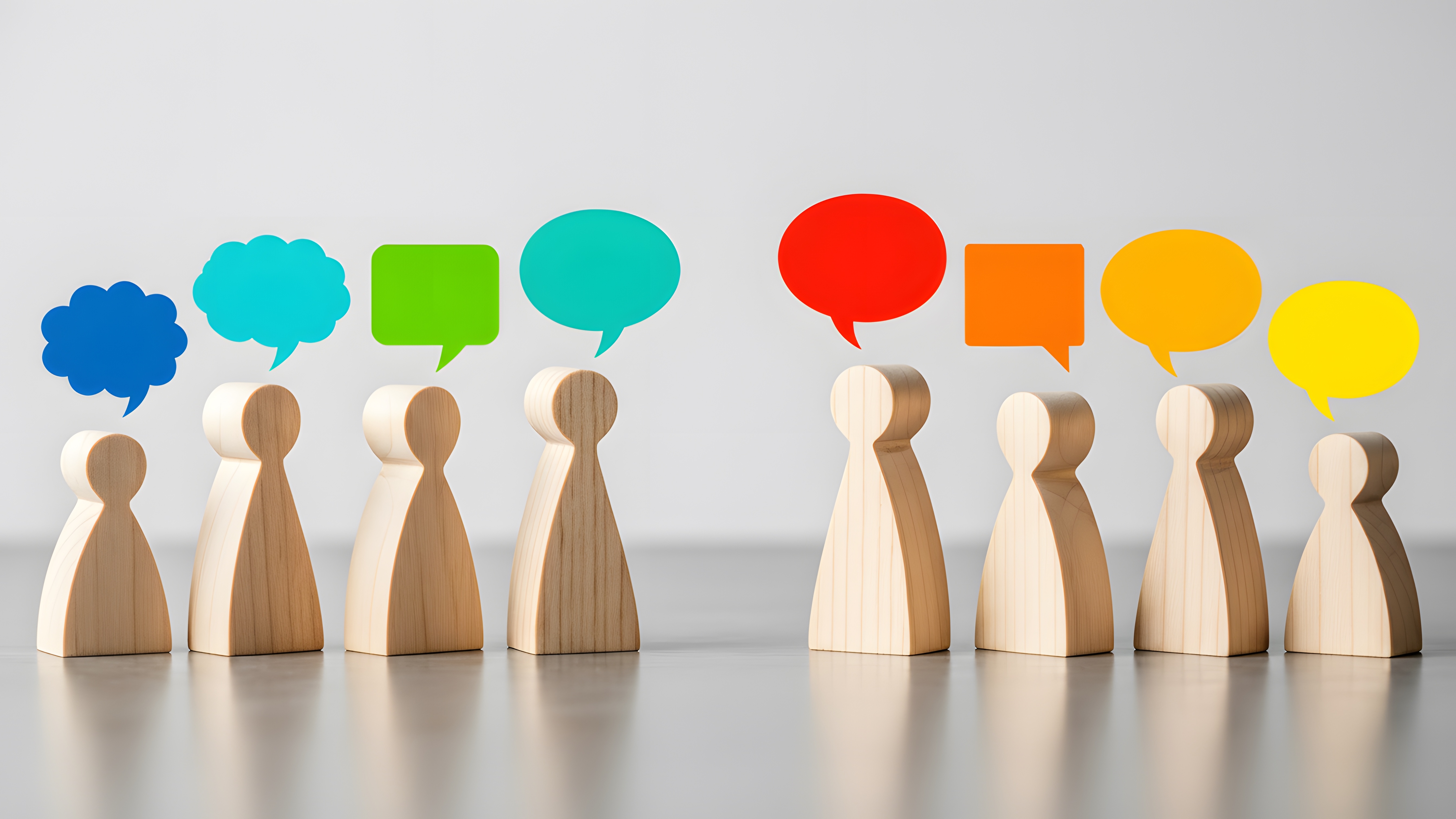 Wooden models with speech bubbles