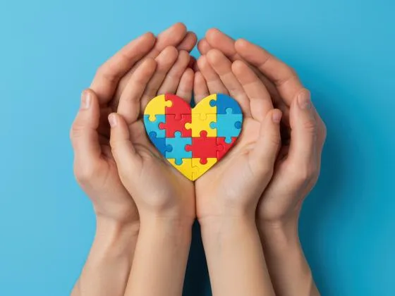 Hands holding jig-saw puzzle