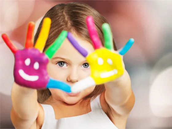 Child with painted hands