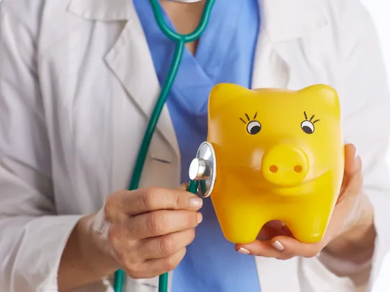 Toy yellow pig and a stethascope