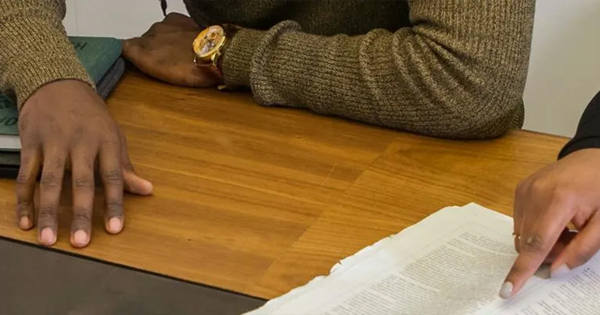 People looking at document