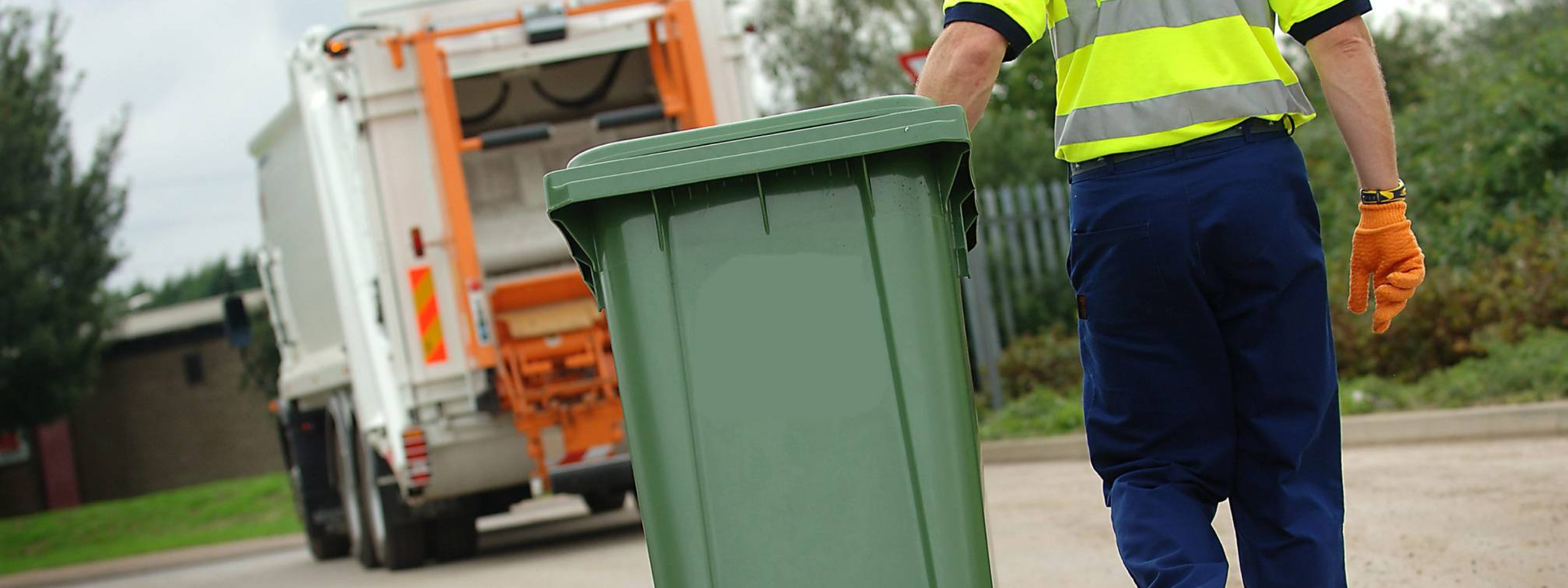 Wheelie bin being collected 